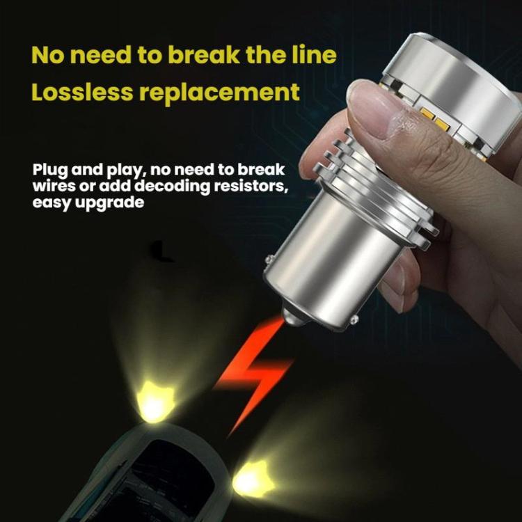 Hand holding silver LED turn signal bulb with yellow chip LED panel