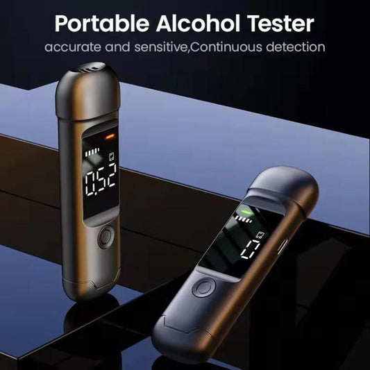 Portable breath alcohol tester in dark finish with lit screen and indicator bars