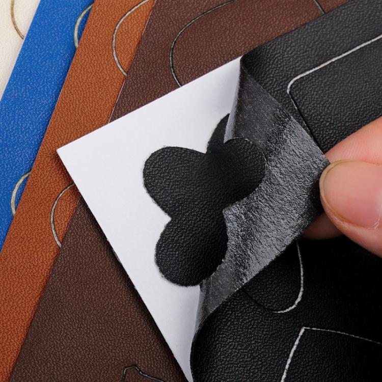 Black leather repair patch applied over a curved scratch on upholstery