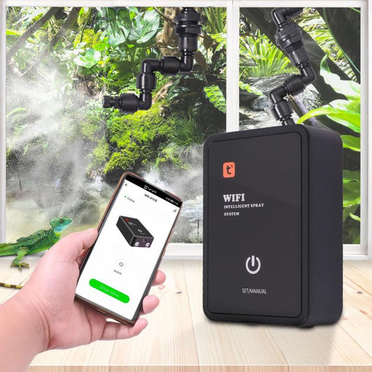 Black WiFi misting system controller with power button, held in a hand