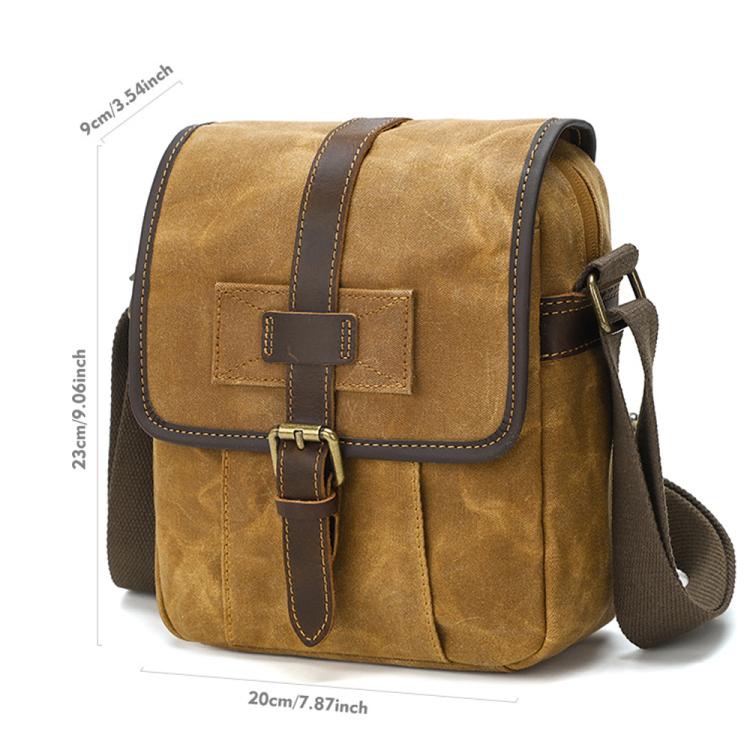 Mens waxed canvas crossbody bag, dusty yellow, brown leather flap and buckle.