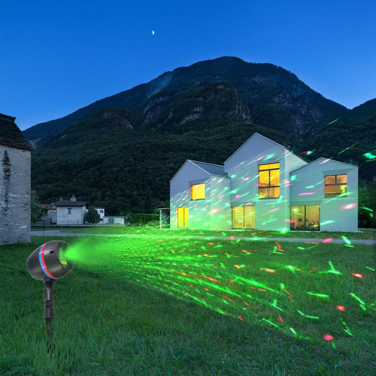 Round in-ground laser garden light projecting a green laser pattern from spike fixture