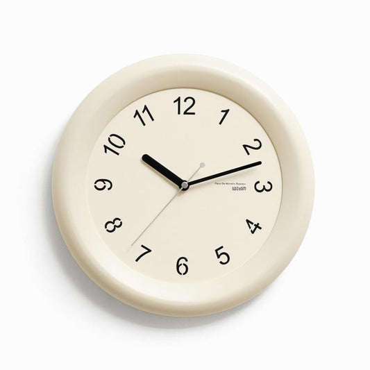 Silent wall clock, beige rim and dial with black second hand and Arabic numerals