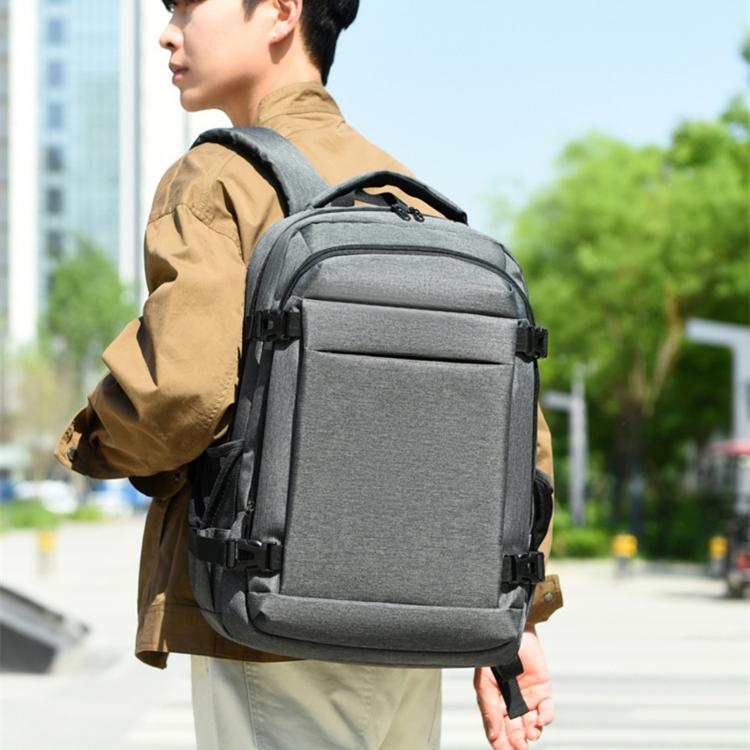 Gray business laptop backpack with front zip pockets and padded shoulder straps