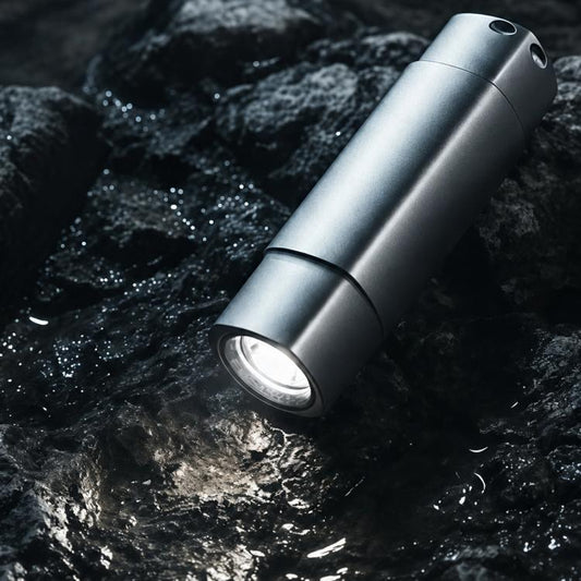 Mini rechargeable flashlight, dark silver aluminum body, front beam opening