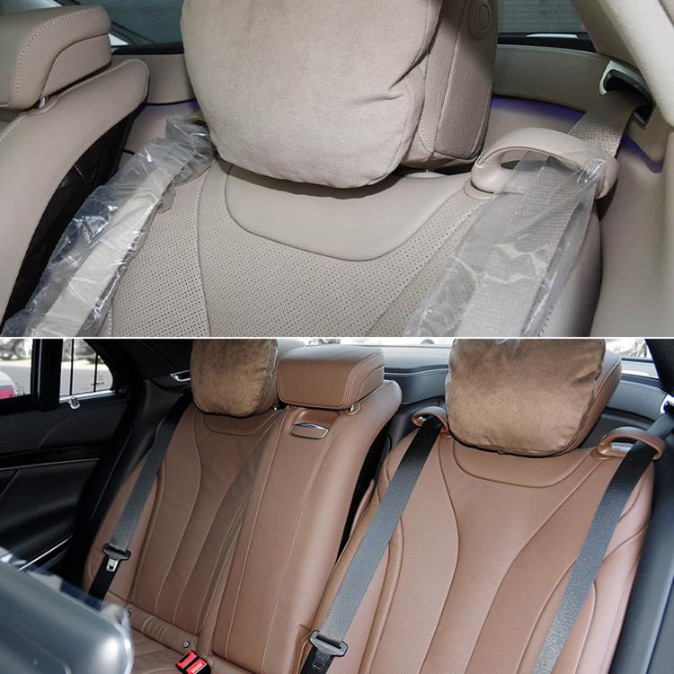 Mercedes-Benz rear seat belt guide cover installed on tan leather seat