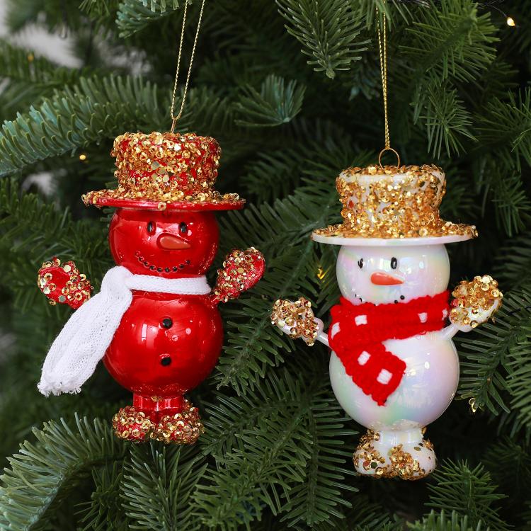 Hanging pair of snowman ornaments: red with white scarf, white with red scarf