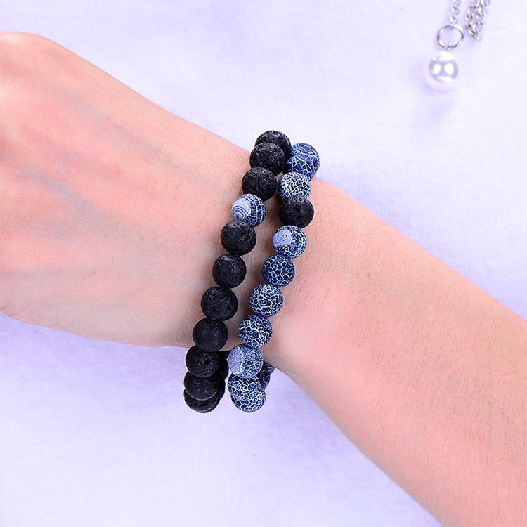 Couples lava bead bracelets worn on wrist, black and blue crackle beads