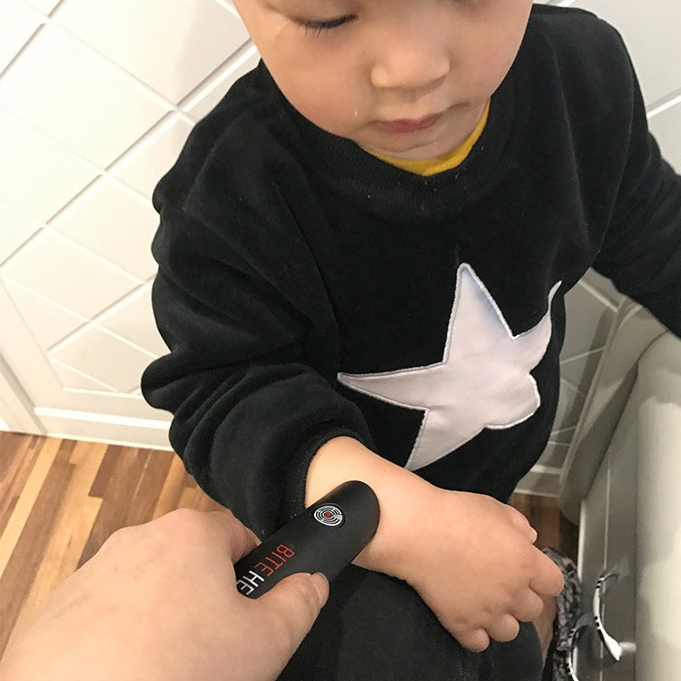 Mosquito bite relief pen being used on a child’s arm, red indicator visible