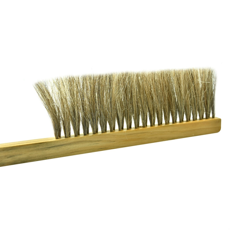 Close-up of stiff boar bristles on wooden sweep brush