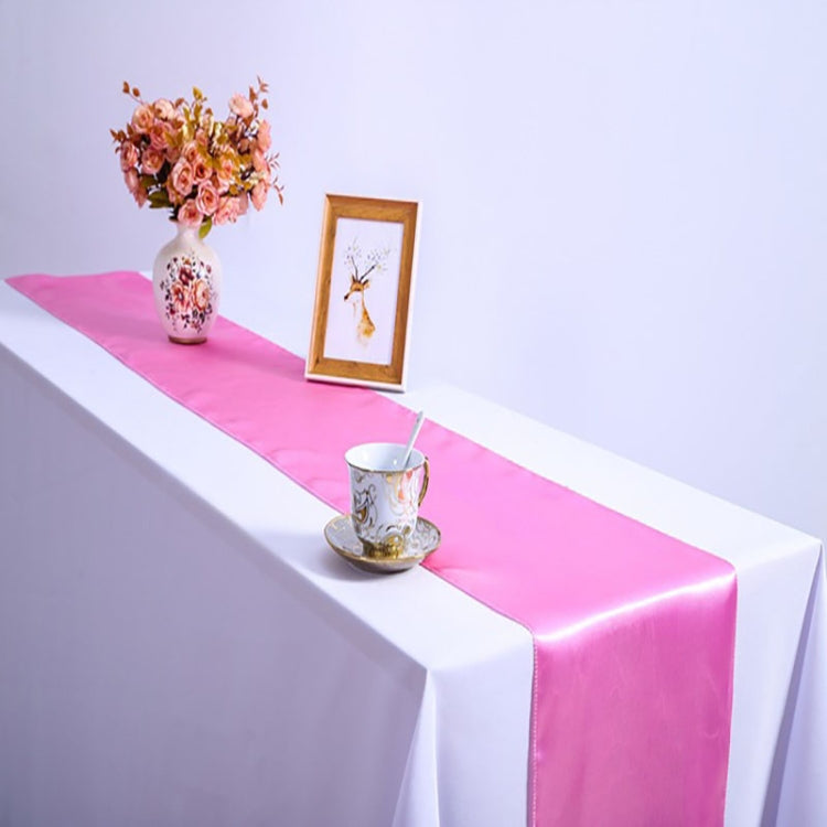 Satin tablecloth with pink runner stripe and draped white sides