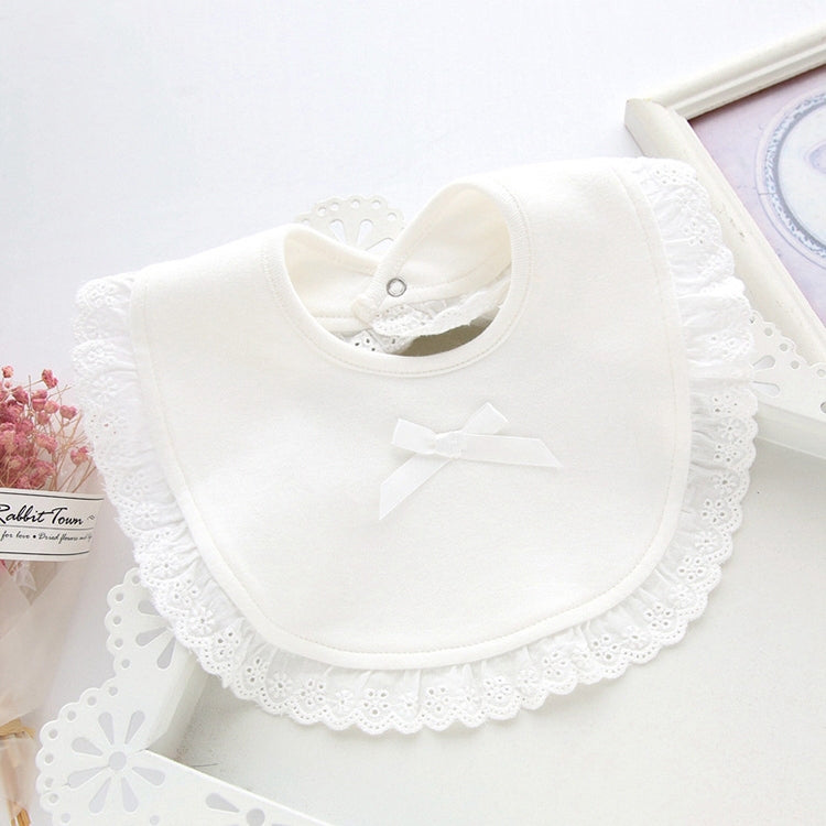 White newborn bib towel with lace ruffle trim and center bow applique.