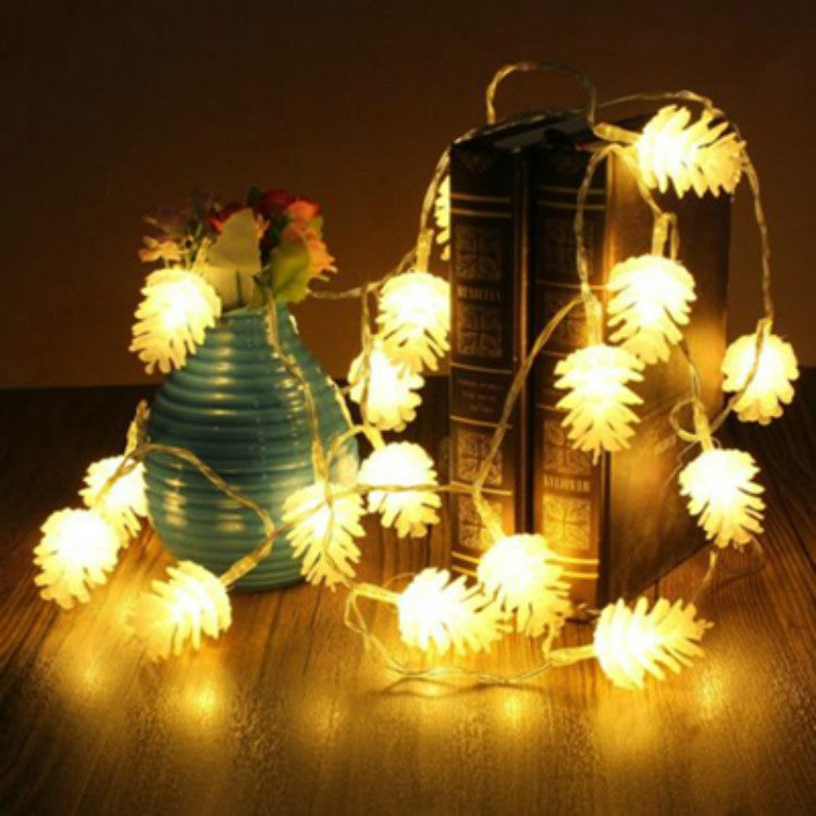 Solar pine cone string lights with warm yellow LED glow for outdoor holiday decor