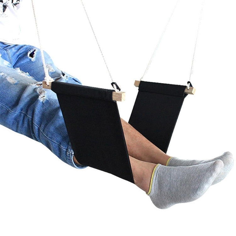 Black mini foot hammock attached to feet for elevated foot rest