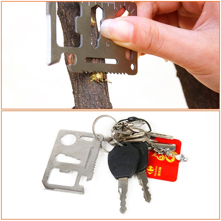 Stainless steel multi-tool card attached to a key ring with keys