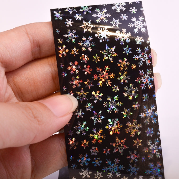 Holographic snowflake nail foil sheet, black design with multicolor snowflake decals