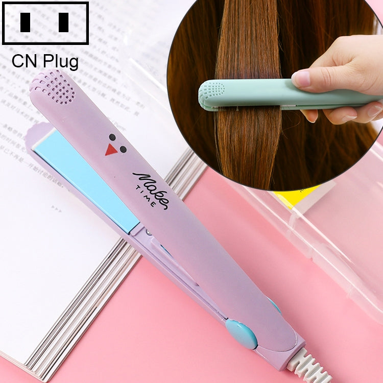 Mini hair straightening iron with corrugated plates, pink body and light blue handle