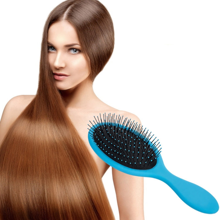 Blue hair brush with oval black bristles, brushing long hair