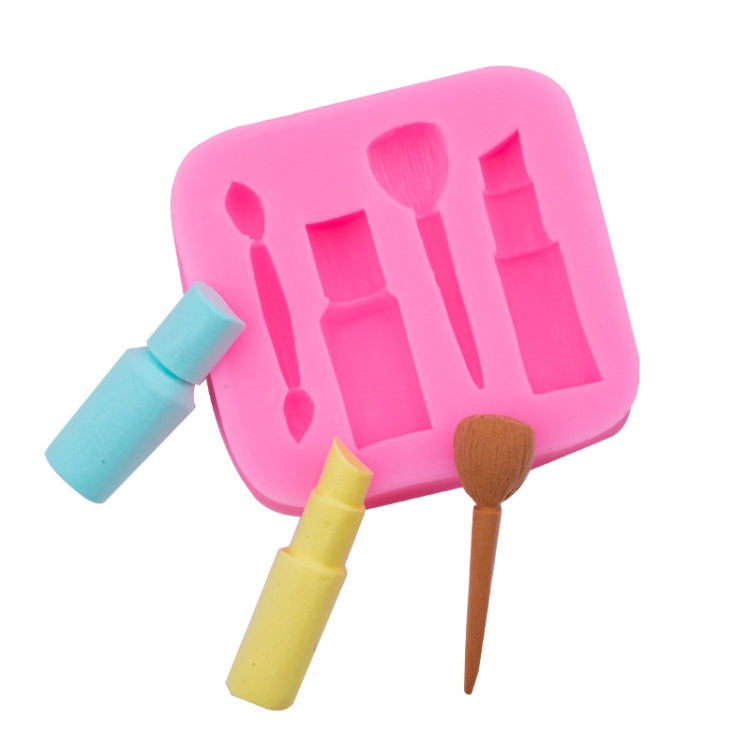 Pink silicone mold with brush, bottle, and lipstick-shaped cavities