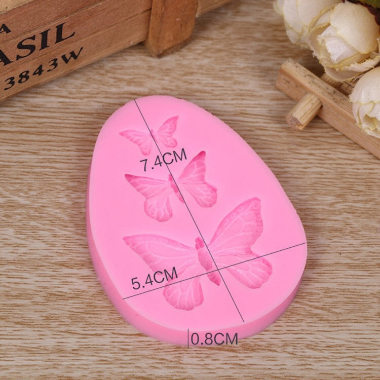 Pink silicone butterfly mold with embossed butterflies and size 7.4cm, 5.4cm, 0.8cm
