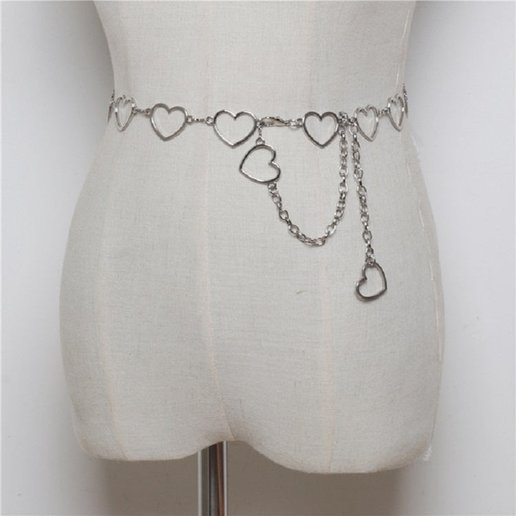 Silver-tone heart link waist chain with dangling heart charms on a belt