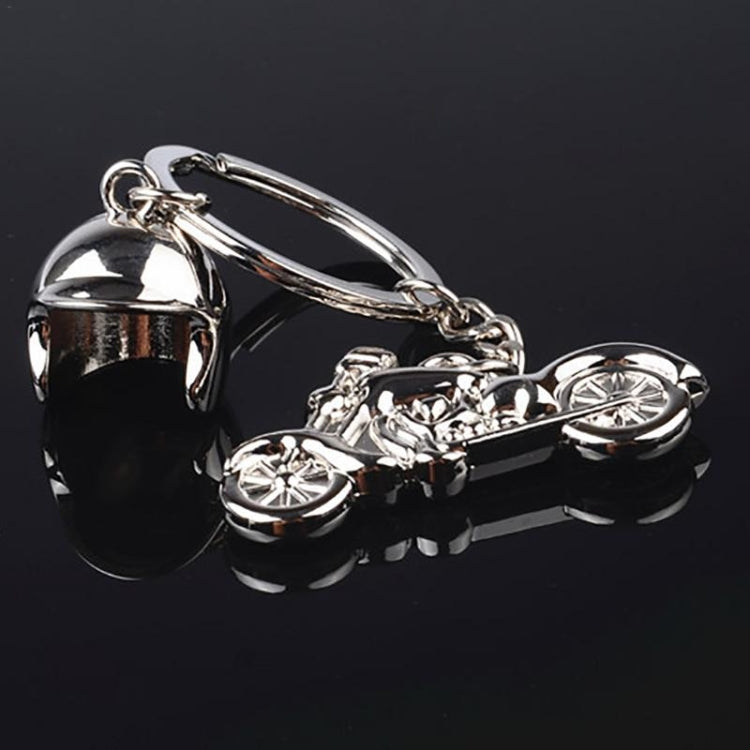 Chrome motorcycle keychain with helmet charm and motorcycle charm, linked to key ring