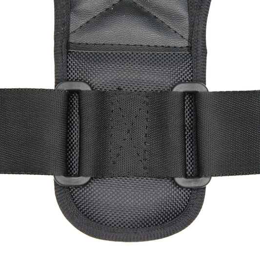 Adjustable black strap and buckle on posture corrector back brace, padded interior