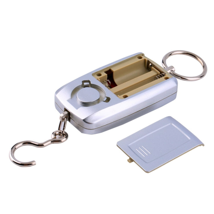 Portable digital hanging scale base with open battery compartment and keyring, white body