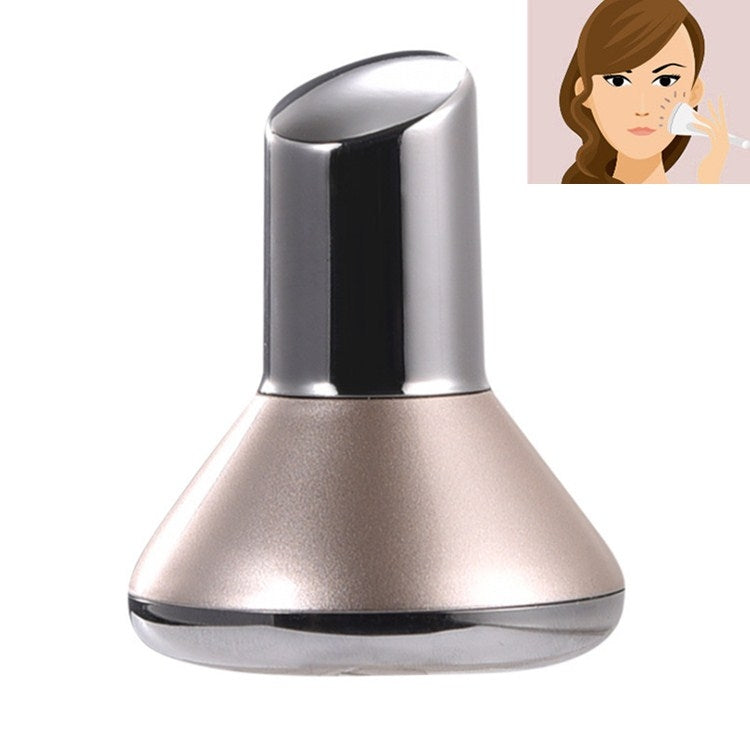 Handheld facial beauty massager with silver top and rose-gold base