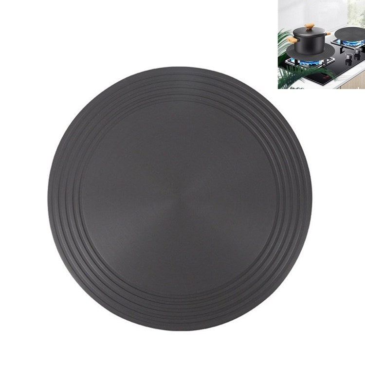 Round black heat-conducting stove plate with concentric ridges around a flat center
