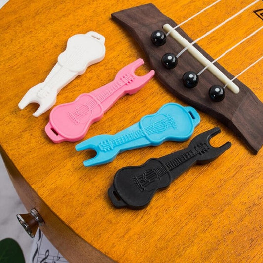 Acoustic guitar string tool kit with colorful string pullers and cone holder