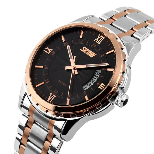 Close-up of two-tone metal wrist watch with black dial, rose-gold rim, and crown on the side