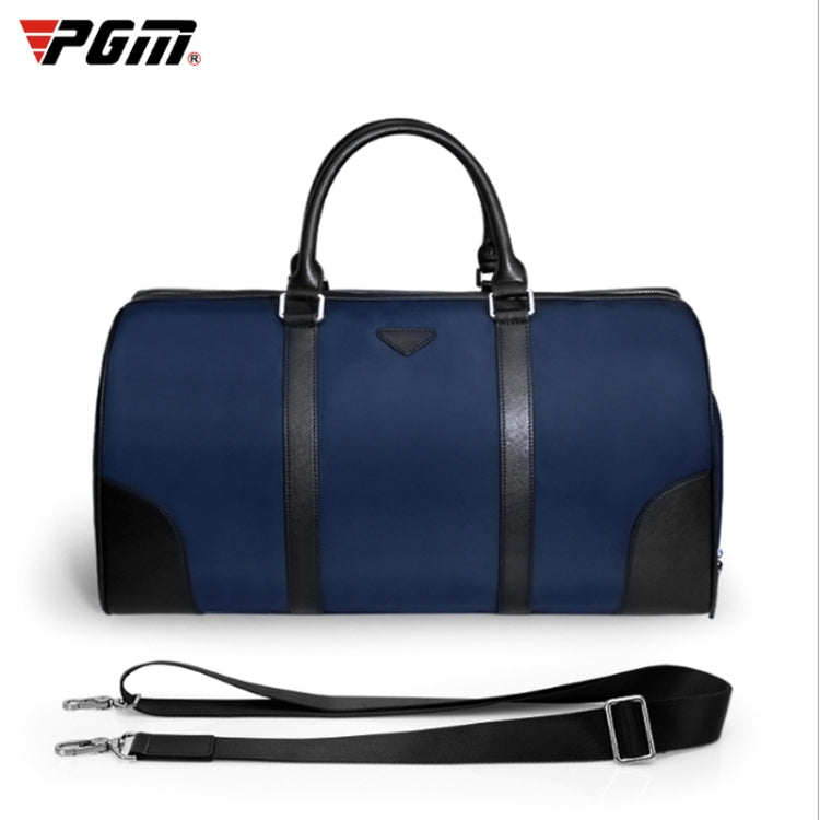Blue nylon duffel-style clothing bag with top handles and adjustable shoulder strap