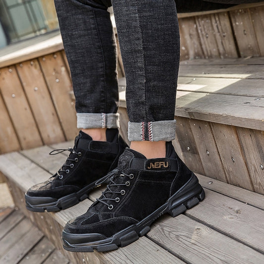High-top black lace-up safety welding shoes with thick rubber sole and side panels