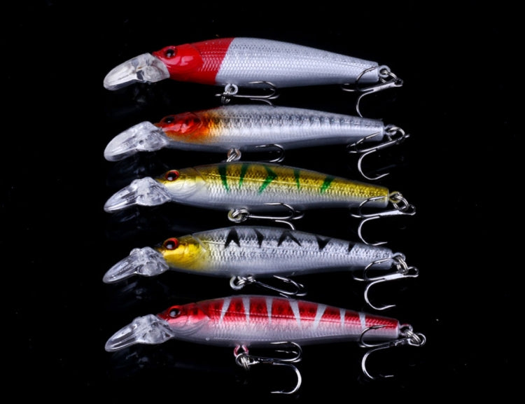 Close view of metal sequin fishing lures with painted bodies and treble hooks