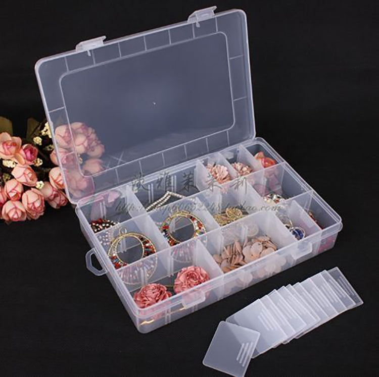 Open clear tackle box with 24 compartments, dividers, and organizer inserts