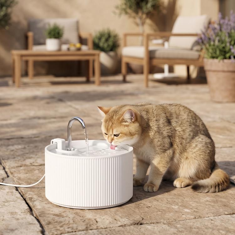 White ceramic cat water fountain with faucet, round ribbed basin, pet drinking
