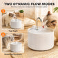 White ceramic pet water fountain with flowing water from chrome faucet