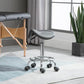 Gray padded saddle stool on rolling chrome base with five casters