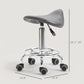 Gray saddle stool on rolling base with height range indicator