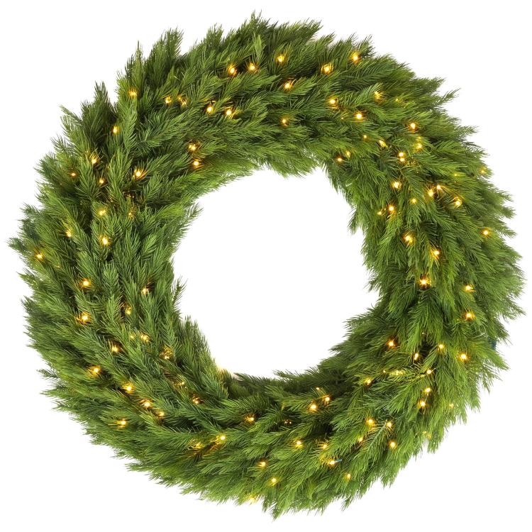 Green artificial Christmas wreath with glowing LED lights, close-up