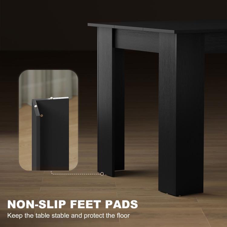 Non-slip foot pads on the underside of a dark rectangular dining table