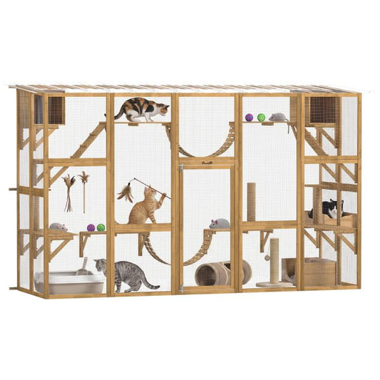 Wooden outdoor cat enclosure with mesh panels, shelves, and rope bridges; cats inside.