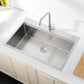 Single-bowl stainless kitchen sink with faucet and deep rectangular basin with drain
