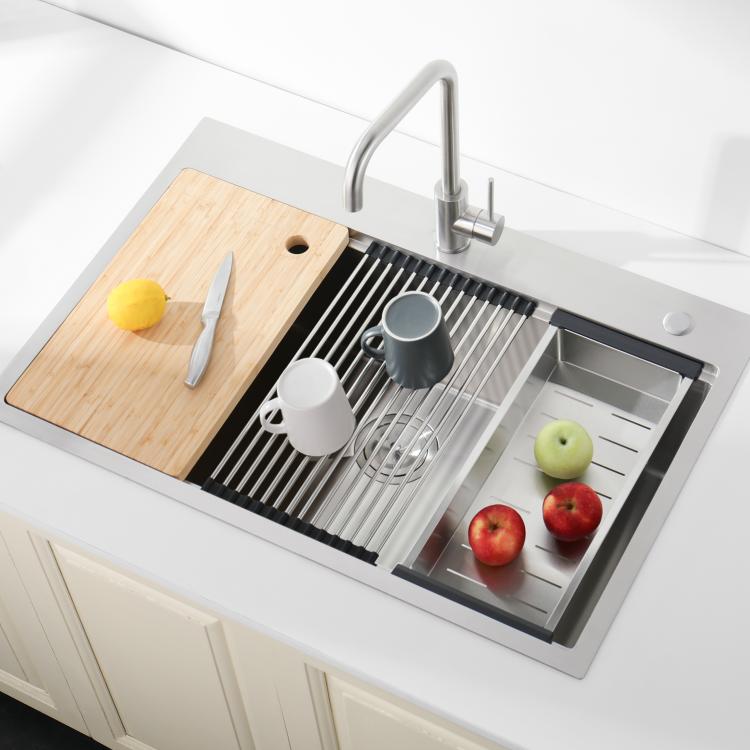 Overmount single-bowl sink with bamboo cutting board, roll-up rack, and fruit