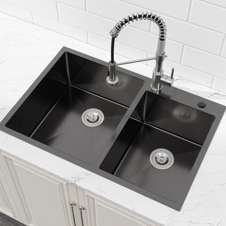 Black double-bowl kitchen sink shown at an angle with two drain strainers