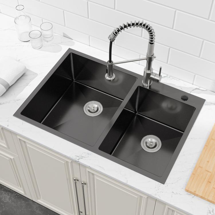 Black double-bowl kitchen sink with faucet holes and two drain openings