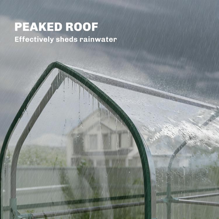 Clear mini greenhouse arched roof with water droplets on transparent panel