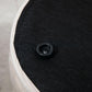 Corduroy storage ottoman lid release knob on round base