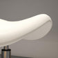 Close-up of white padded saddle seat with textured PU leather surface